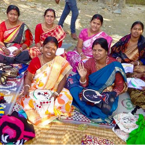 Women stitching and doing embroidery in a group