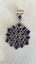 Handcrafted silver pendant studded with semi precious Amethyst stones